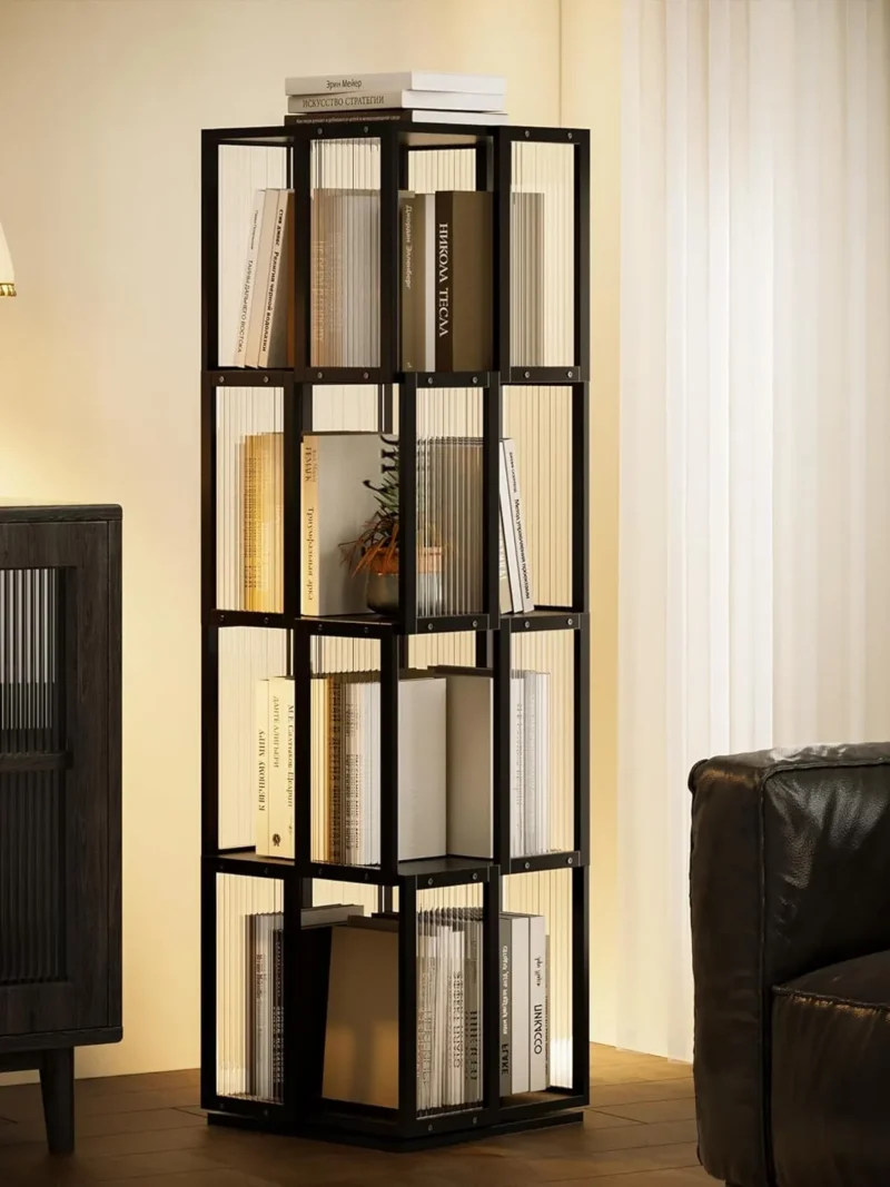 A black 4-tier rotating shelf styled in a minimalist living room between a modern cabinet and sofa, creating a calm and orderly atmosphere through thoughtful, functional design.